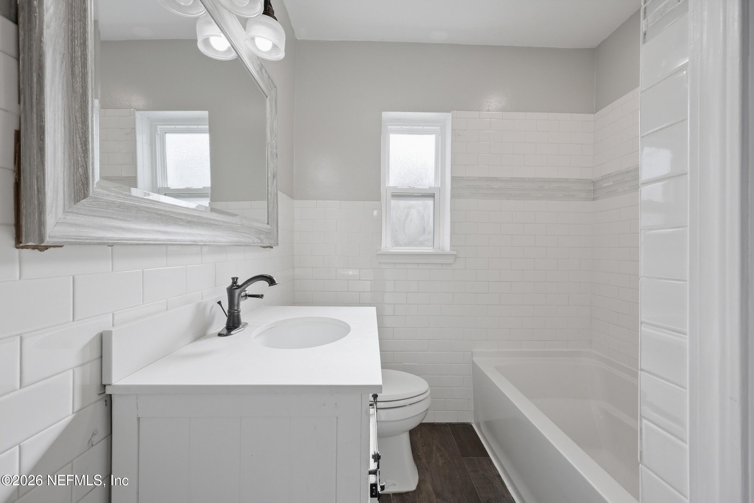 1873 Stanford Road North Jacksonville, FL 32207 - Photo 24 of 37 a bathroom with a sink a toilet and shower