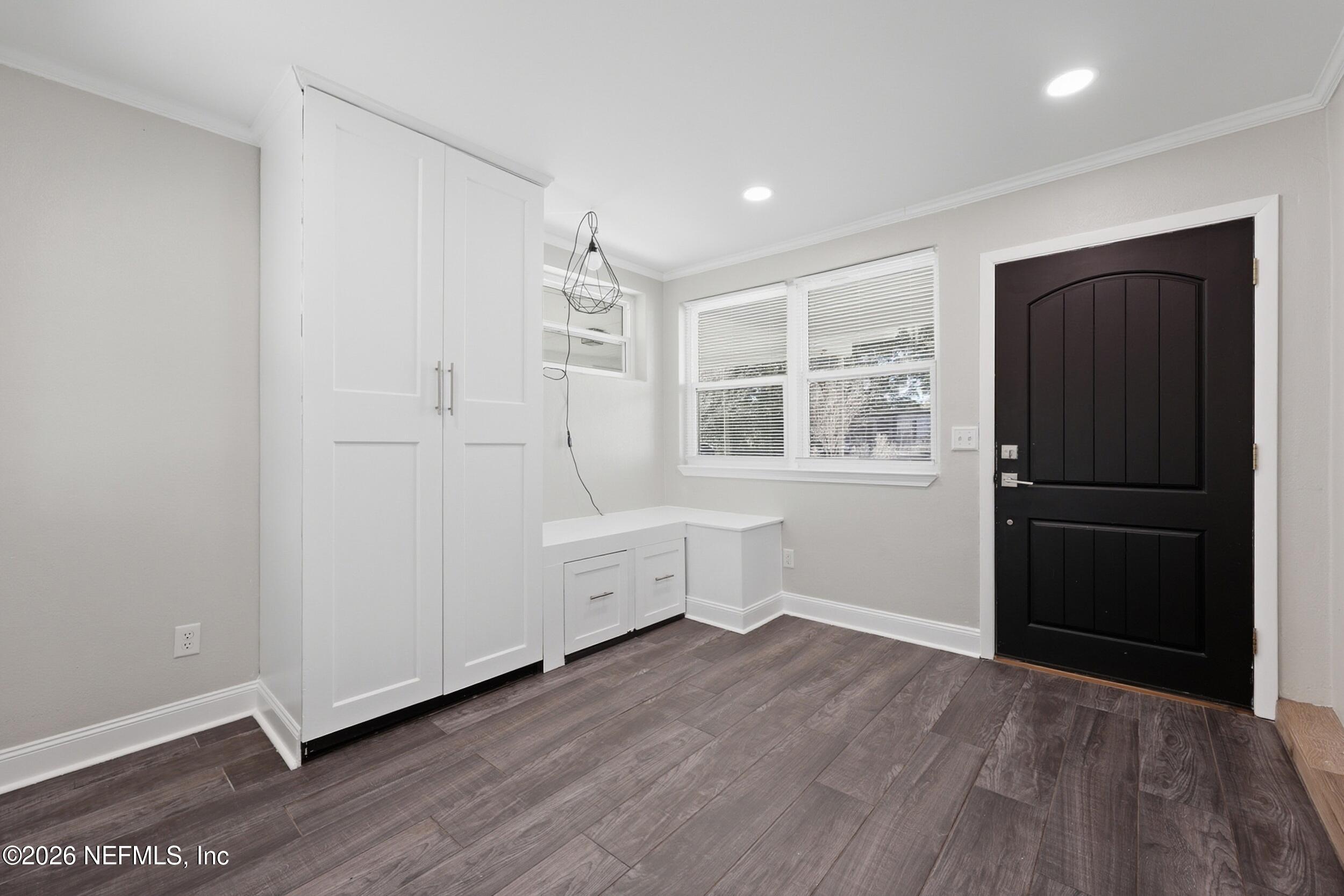 1873 Stanford Road North Jacksonville, FL 32207 - Photo 5 of 37 a view of empty room with wooden floor and cabinet