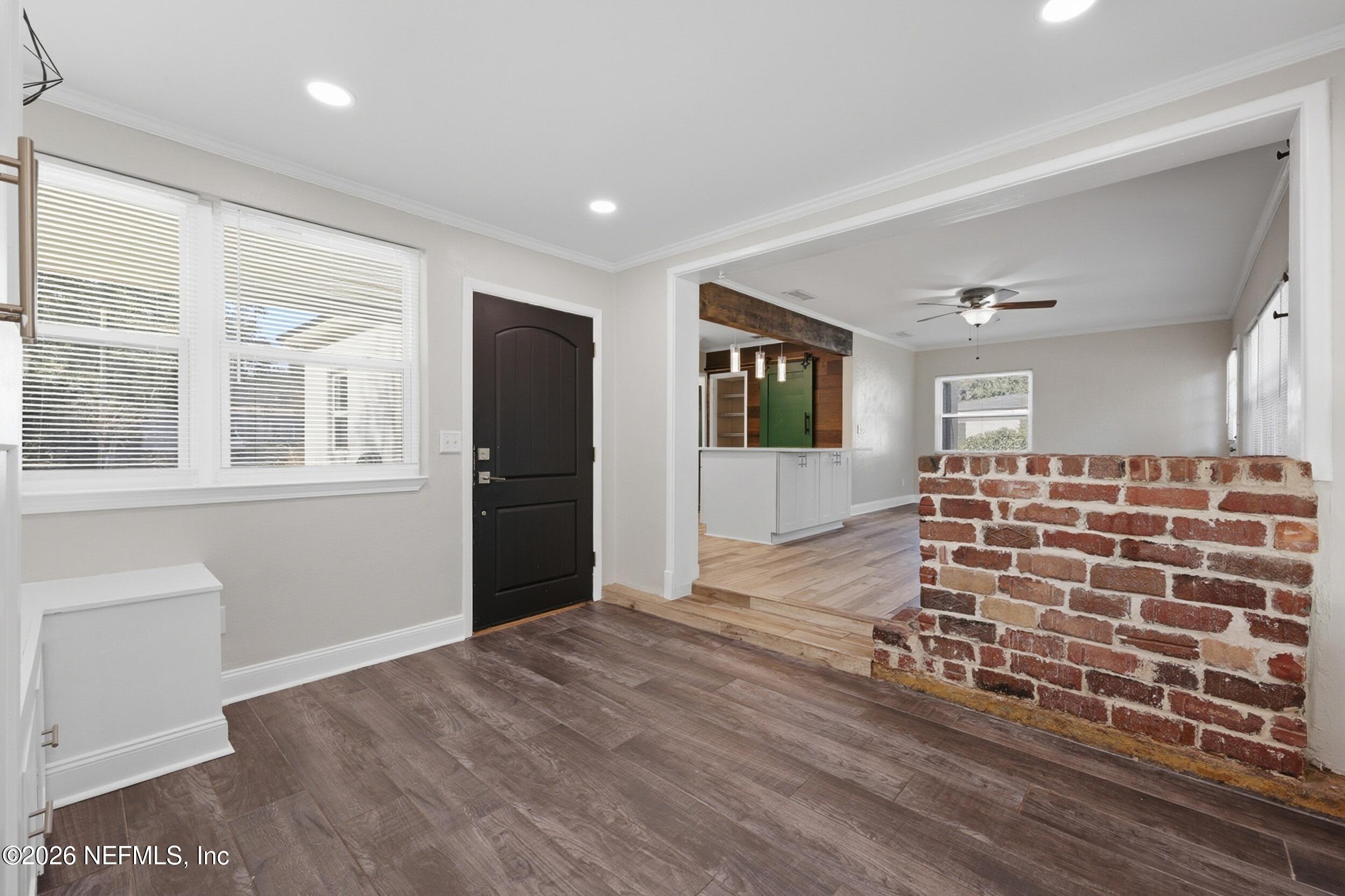 1873 Stanford Road North Jacksonville, FL 32207 - Photo 6 of 37 a view of an empty room with wooden floor and a window