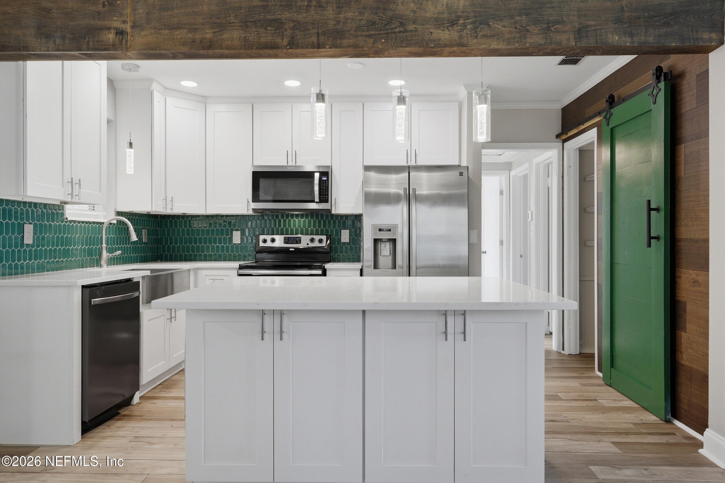1873 Stanford Road North Jacksonville, FL 32207 - Photo 9 of 37 a kitchen with stainless steel appliances granite countertop a refrigerator and a stove top oven