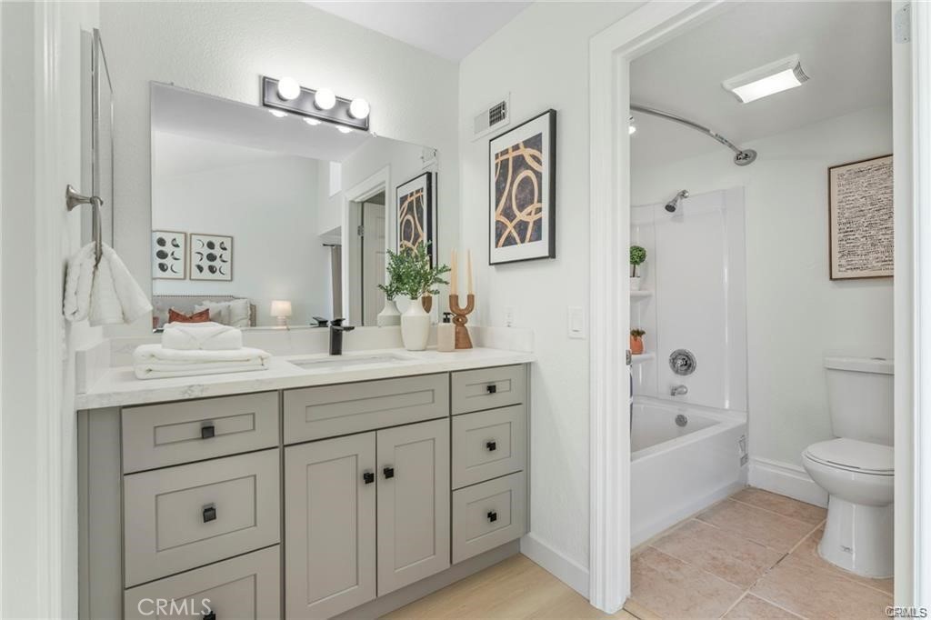 4814 Ranch Road Chino, CA 91710 - Photo 12 of 27 a bathroom with a double vanity sink toilet and shower