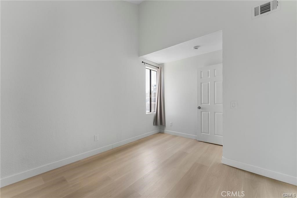 4814 Ranch Road Chino, CA 91710 - Photo 18 of 27 a view of an empty room with wooden floor and closet