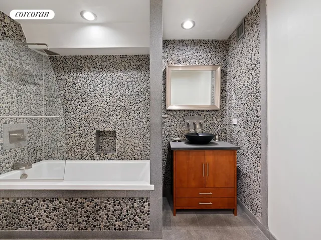 a view of bathroom with a toilet sink and mirror