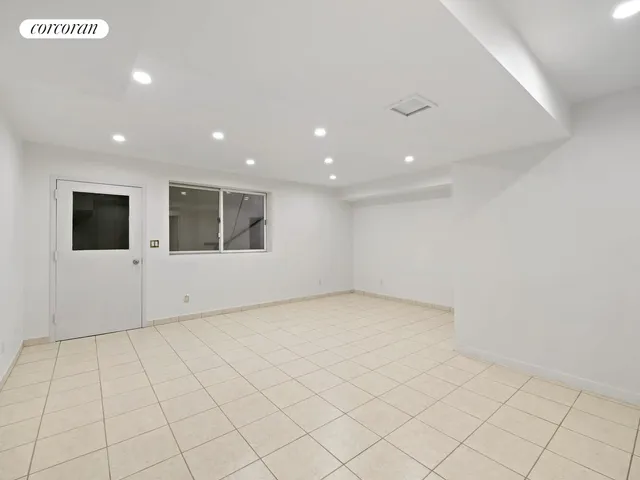 a view of room with hardwood floor and window