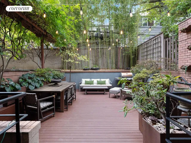 a kitchen with a stove a sink and a microwave