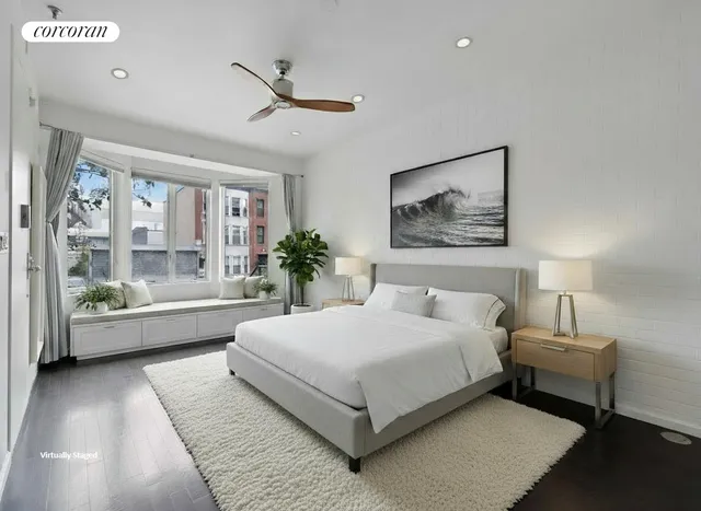 a view of backyard with seating space and trees