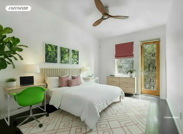 a bedroom with a bed and a desk