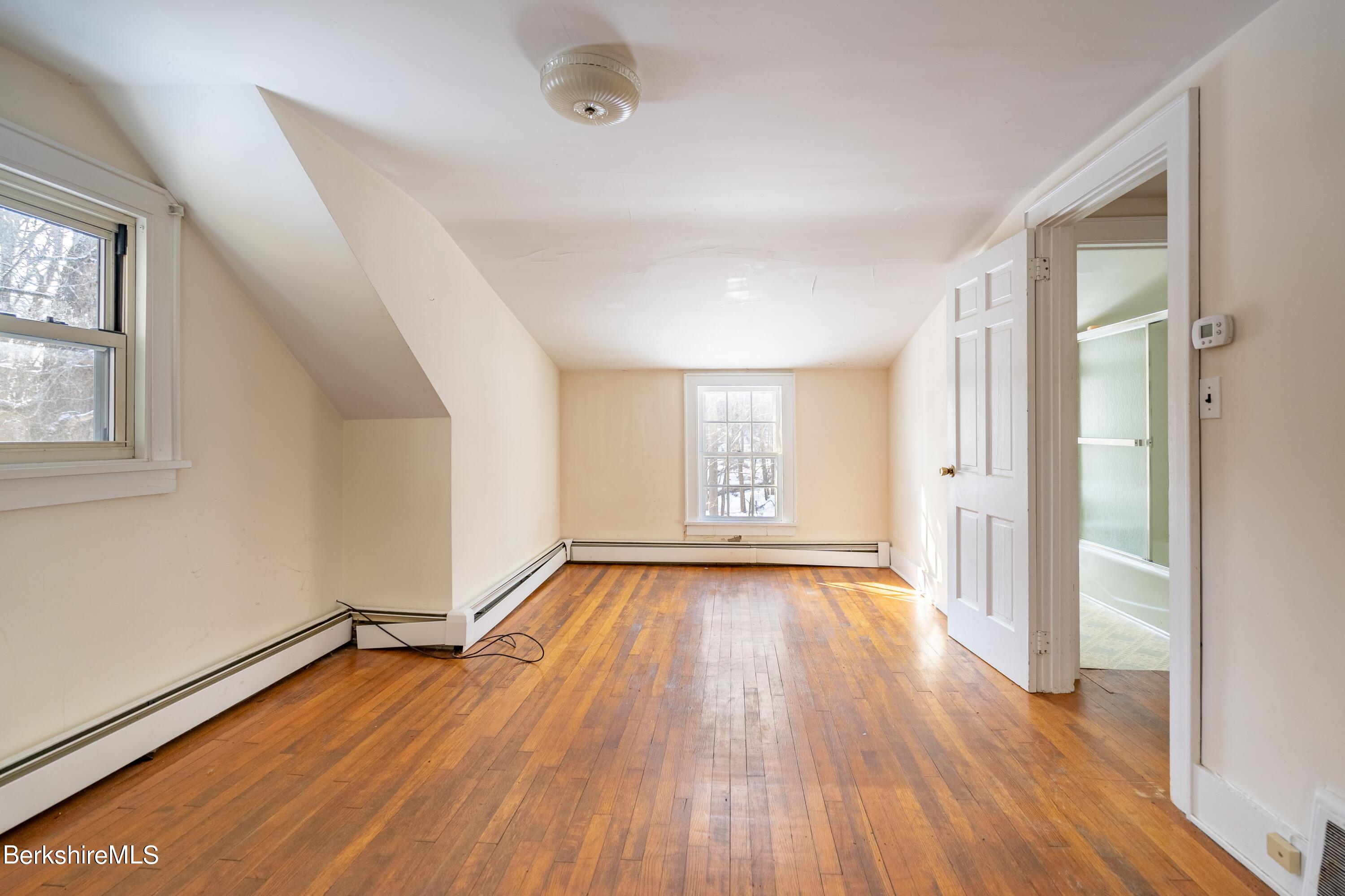 151 Hillsdale Road Egremont, MA 01230 - Photo 14 of 23 wooden floor in an empty room with a window
