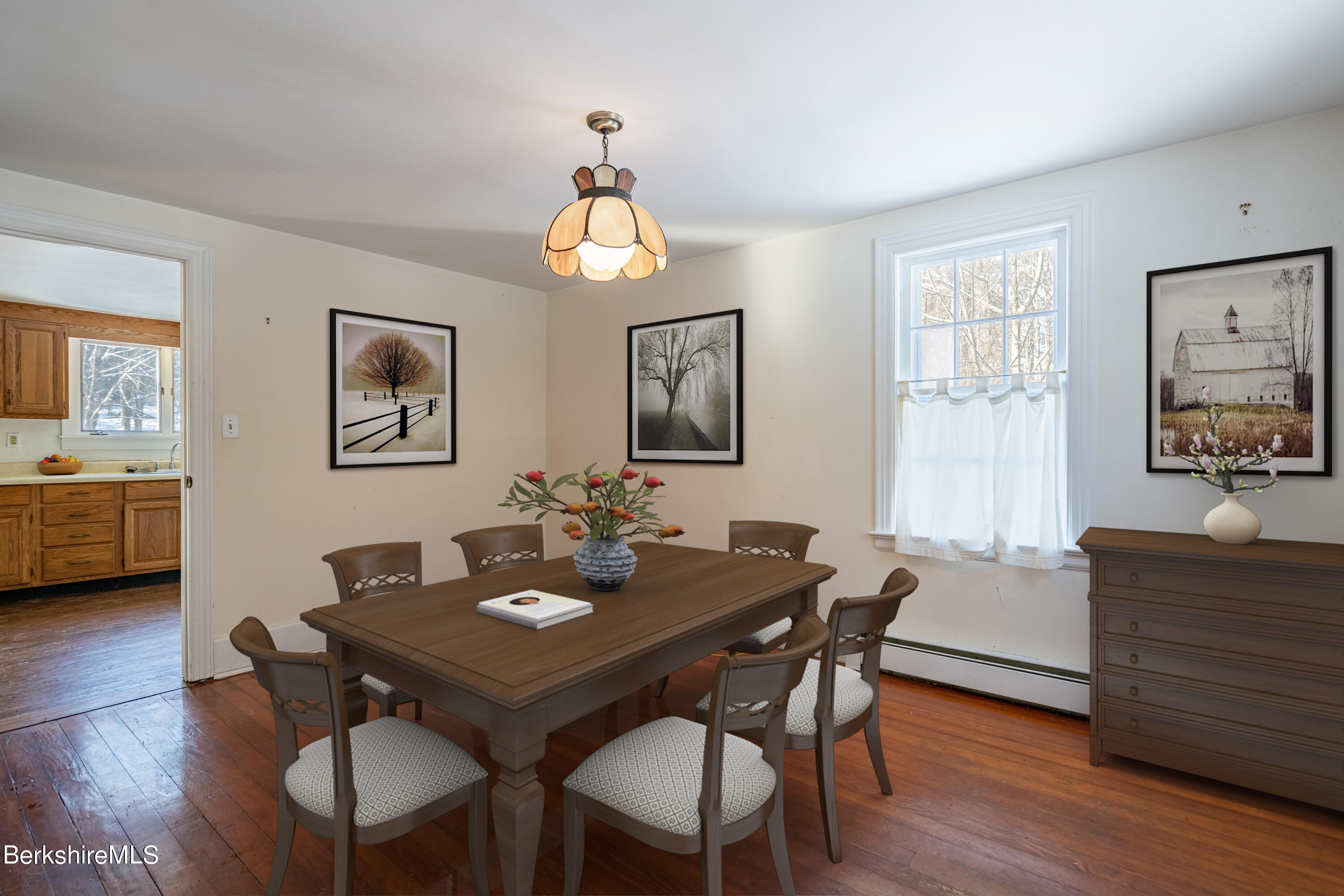 151 Hillsdale Road Egremont, MA 01230 - Photo 7 of 23 a view of a dining room with furniture wooden floor and a chandelier