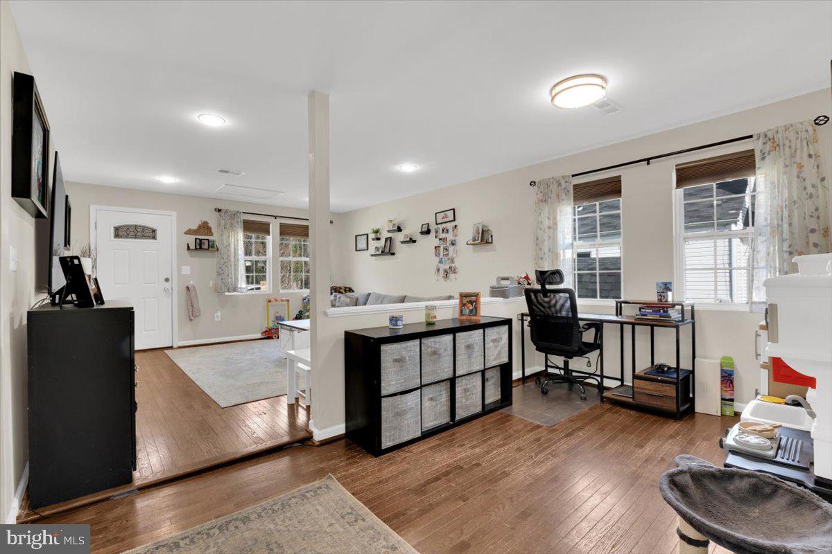 6519 Woodland Road Suitland, MD 20746 - Photo 12 of 35 a living room with furniture and a wooden floor