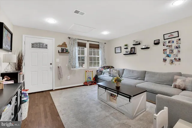 a living room with furniture and window