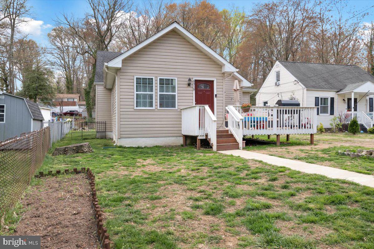 6519 Woodland Road Suitland, MD 20746 - Photo 18 of 35 a view of a house with a yard