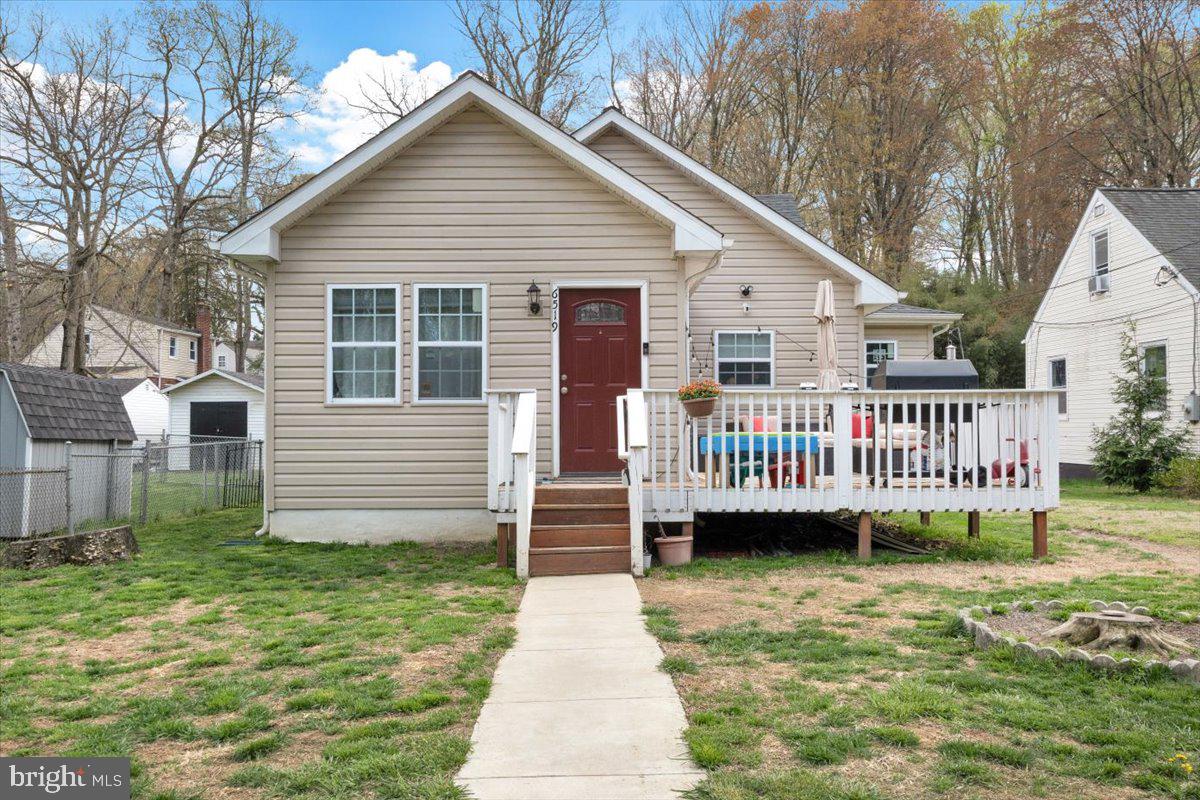 6519 Woodland Road Suitland, MD 20746 - Photo 2 of 35 a view of a house with a yard and deck