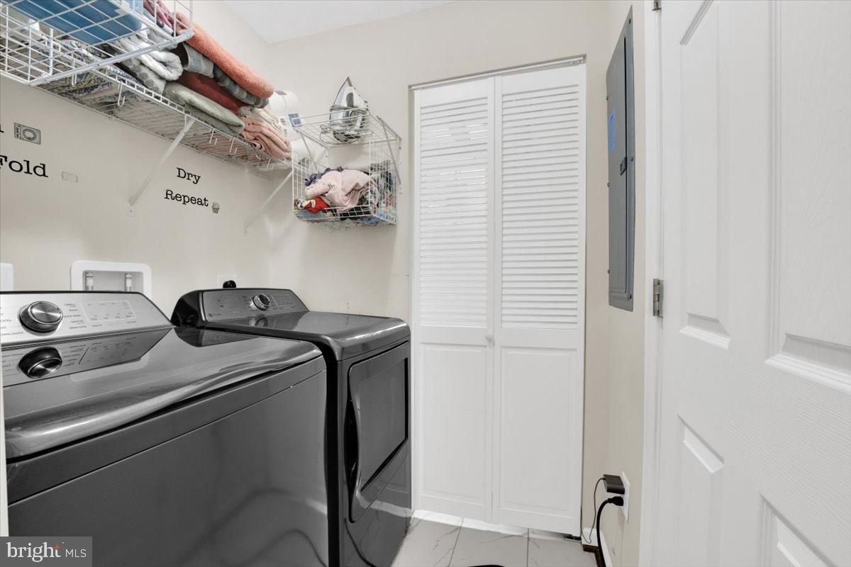 6519 Woodland Road Suitland, MD 20746 - Photo 22 of 35 a utility room with dryer and washer