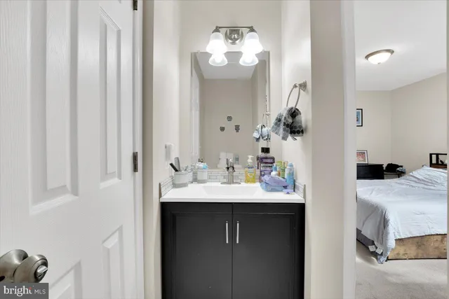 a en suite bathroom with a sink and mirror
