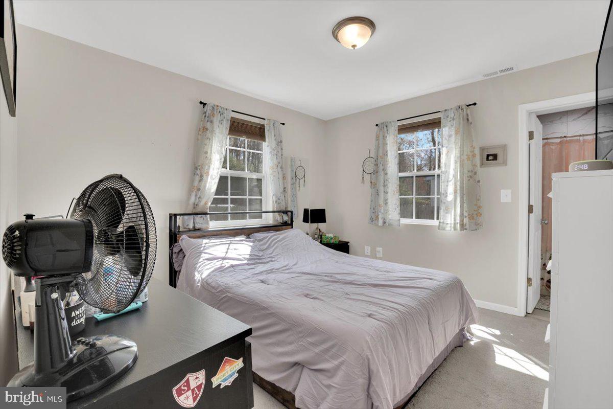 6519 Woodland Road Suitland, MD 20746 - Photo 27 of 35 a bedroom with a bed and a window
