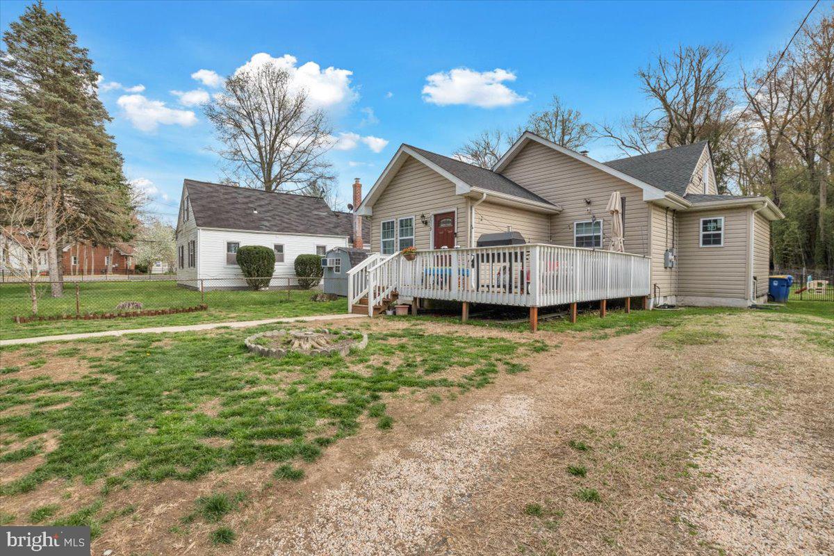 6519 Woodland Road Suitland, MD 20746 - Photo 3 of 35 a view of a house with a big yard and large trees