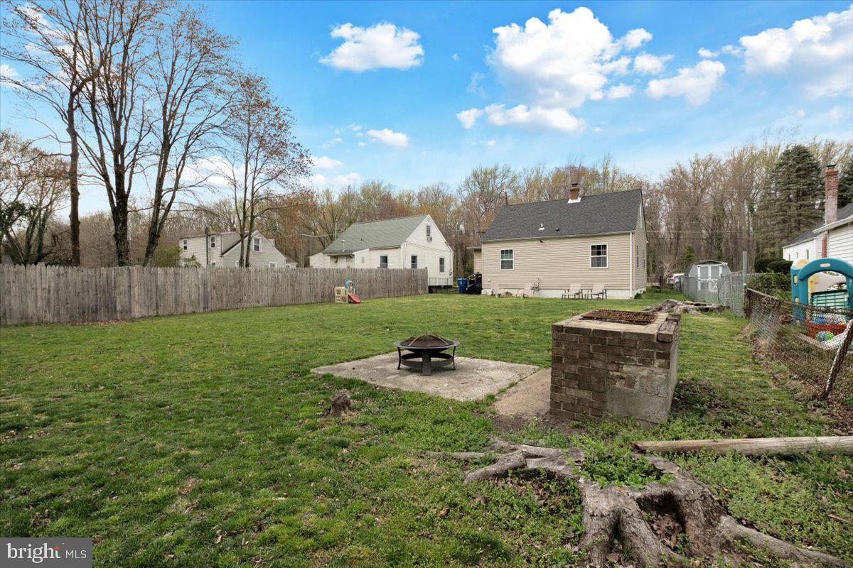 6519 Woodland Road Suitland, MD 20746 - Photo 33 of 35 a backyard of a house with table and chairs