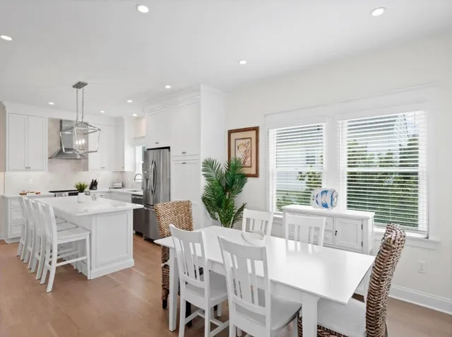 a kitchen with a table and chairs in it