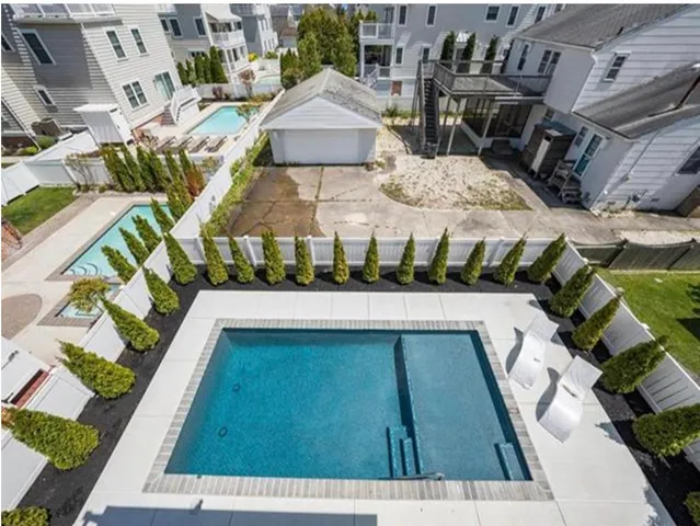 a view of swimming pool with outdoor seating