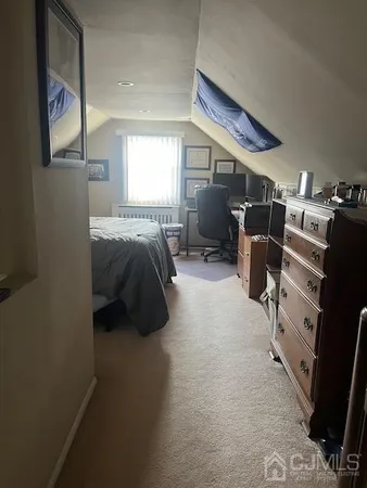 a bed room with a bed and a television