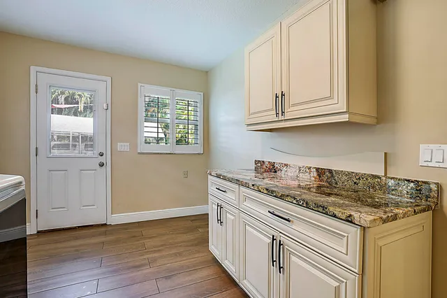 a kitchen that has a sink and a stove