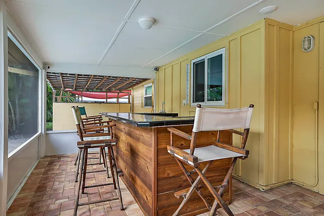a patio with table and chairs