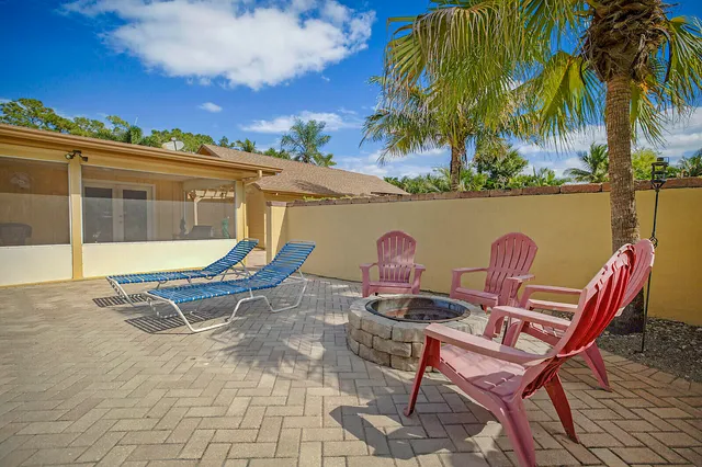 a view of a swimming pool with a lounge chair