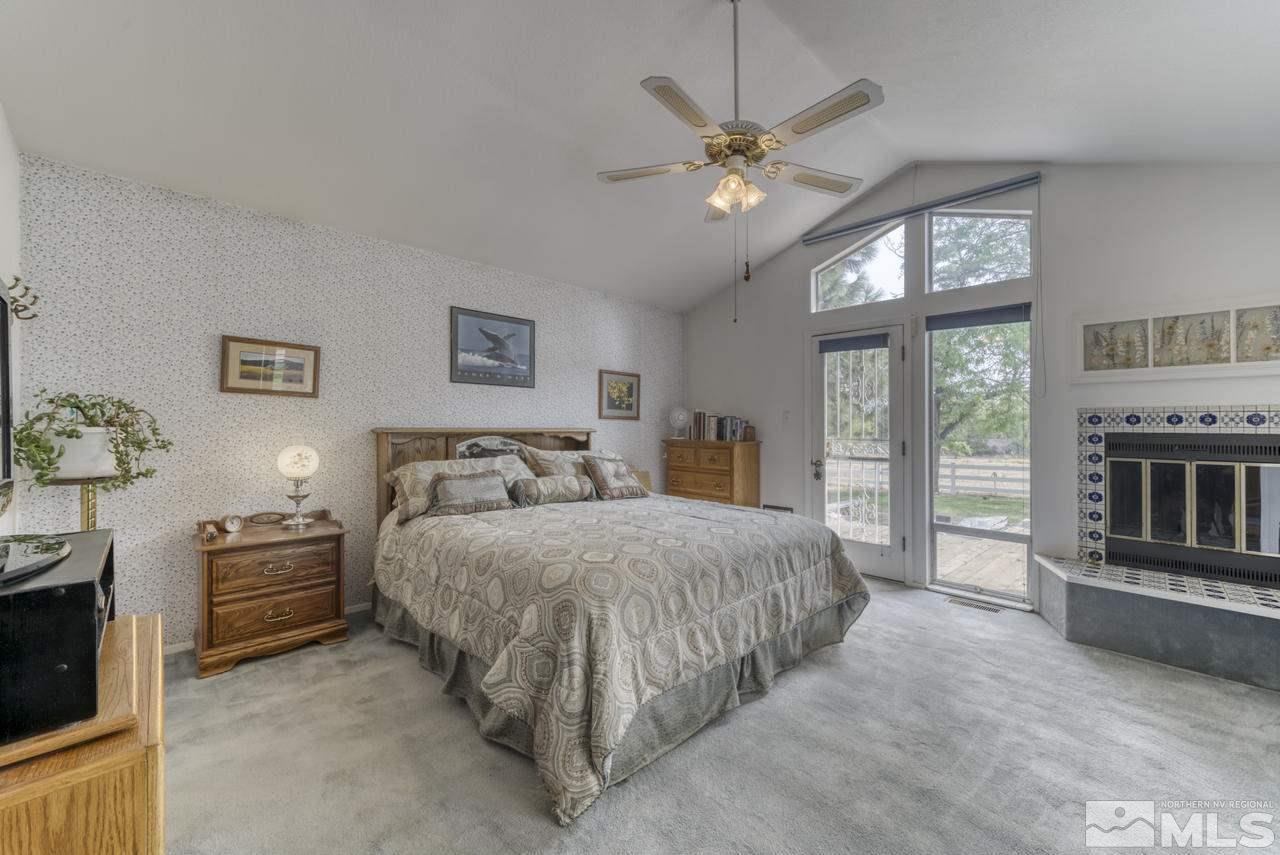 3650 Clover Way Reno, NV 89509 - Photo 11 of 31 a spacious bedroom with a bed and a flat screen tv