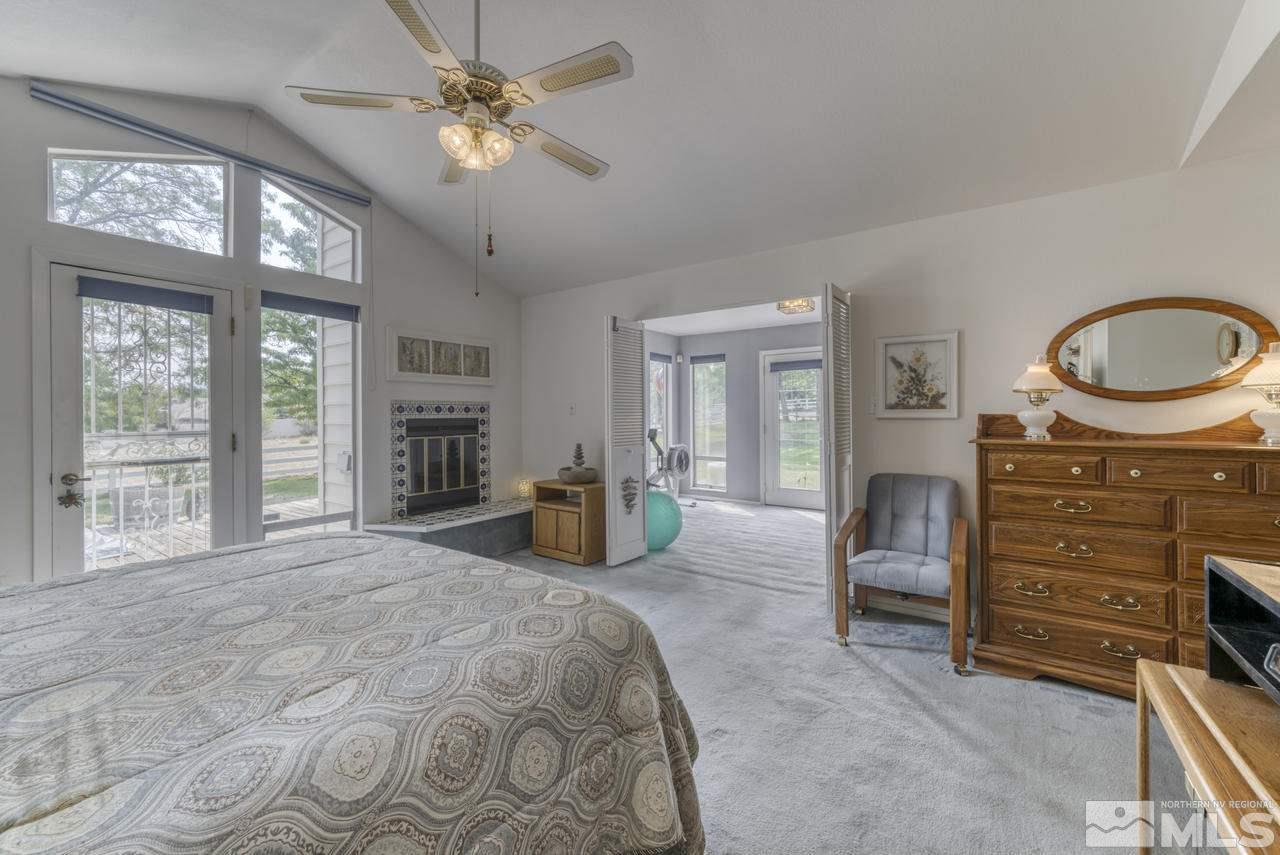 3650 Clover Way Reno, NV 89509 - Photo 12 of 31 a bedroom with furniture and a chandelier