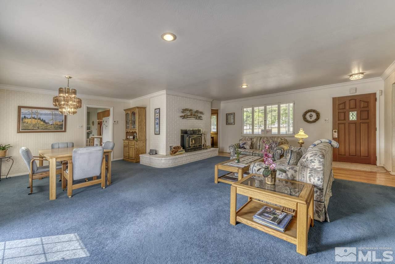3650 Clover Way Reno, NV 89509 - Photo 3 of 31 a living room with furniture and a table