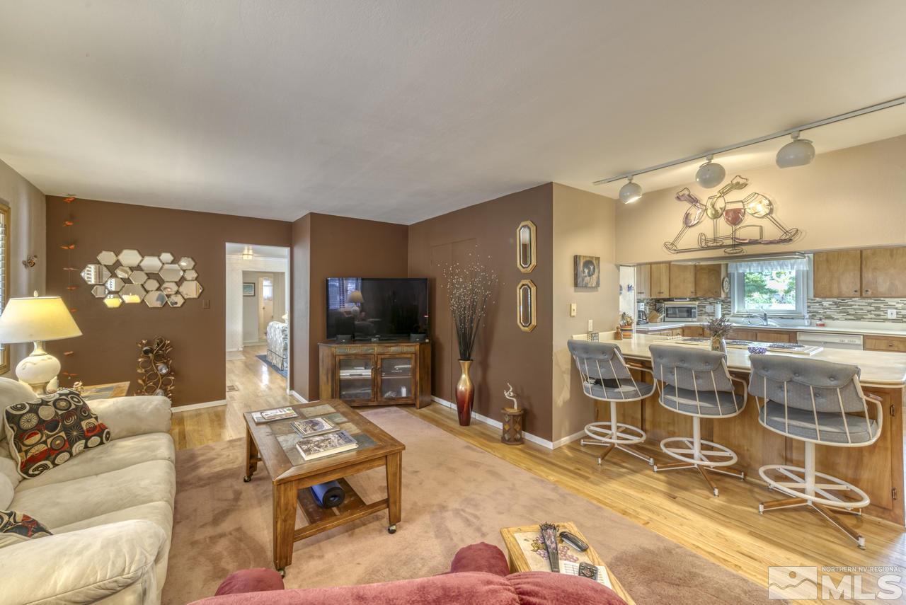 3650 Clover Way Reno, NV 89509 - Photo 4 of 31 a living room with furniture and a flat screen tv