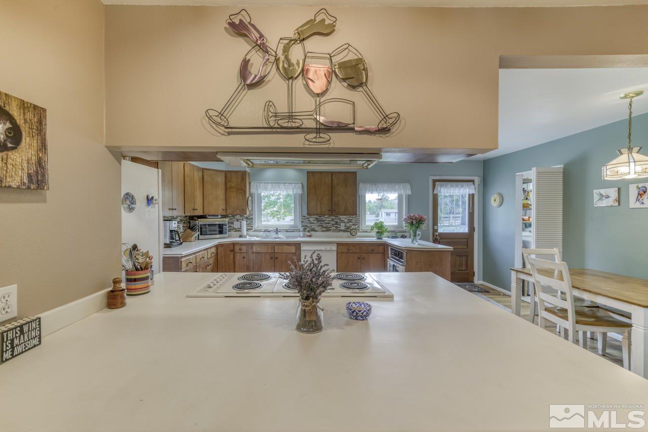 3650 Clover Way Reno, NV 89509 - Photo 8 of 31 a view of a lobby with kitchen island and living room