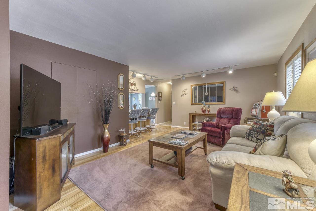 3650 Clover Way Reno, NV 89509 - Photo 10 of 31 a living room with furniture and a flat screen tv