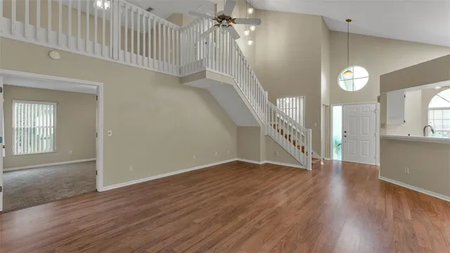 a view of an entryway with wooden floor