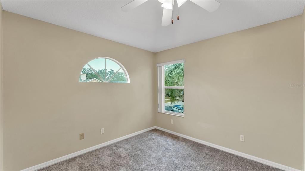 2319 Needham Drive Valrico, FL 33596 - Photo 23 of 35 an empty room with windows and closet