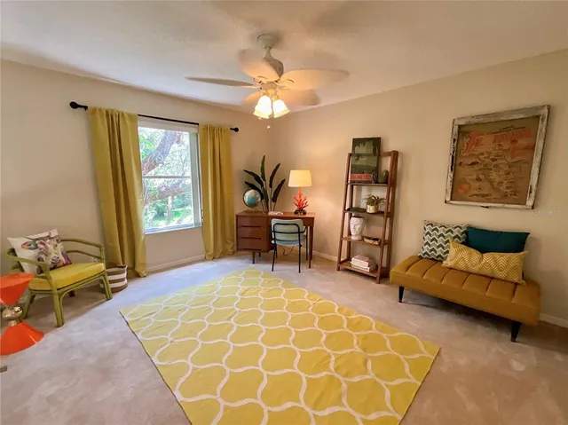 a living room with furniture and a window