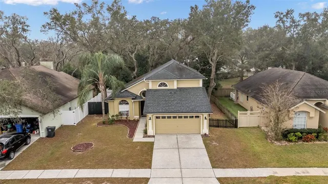 an aerial view of a house with swimming pool