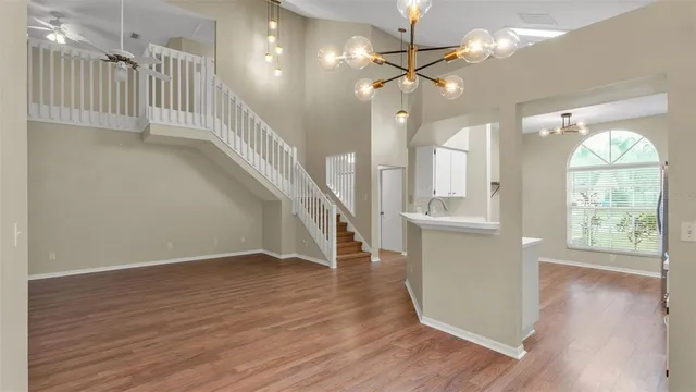 wooden floor in an empty room with a window and wooden floor
