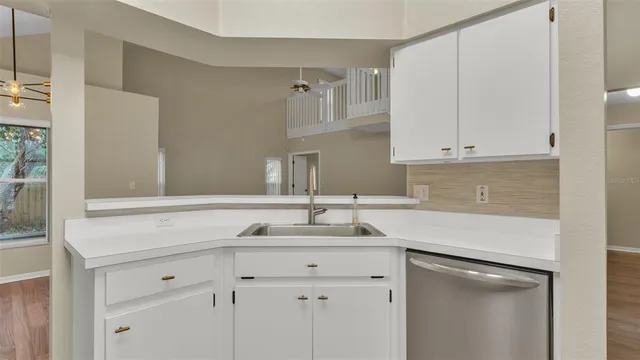 a kitchen with a sink and cabinets