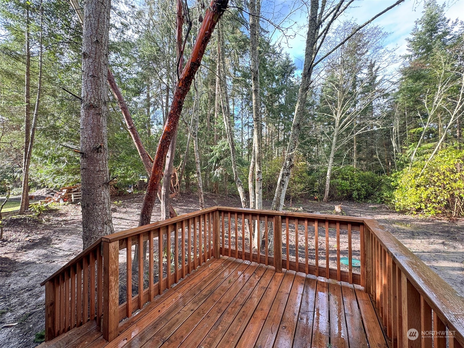 180 Madrona Way Sequim, WA 98382 - Photo 11 of 35 a view of balcony with wooden floor and fence
