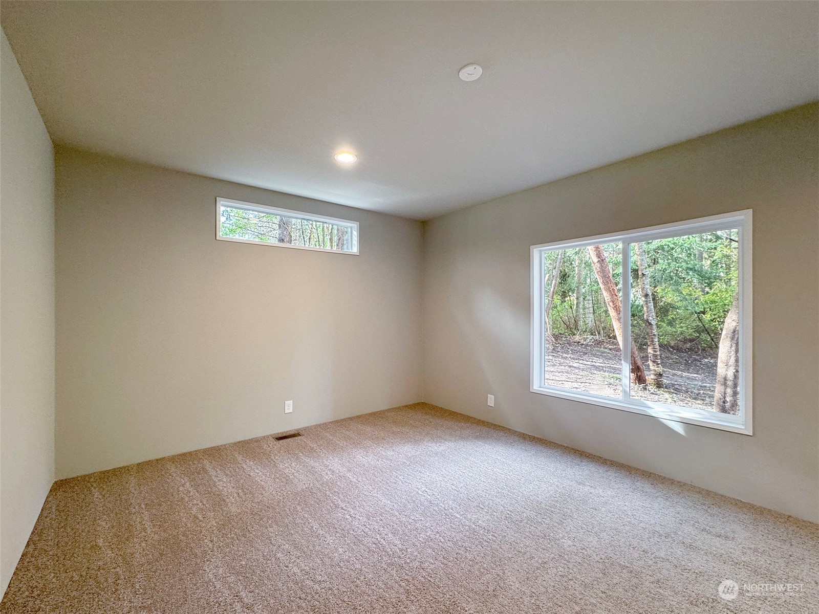 180 Madrona Way Sequim, WA 98382 - Photo 12 of 35 an empty room with windows
