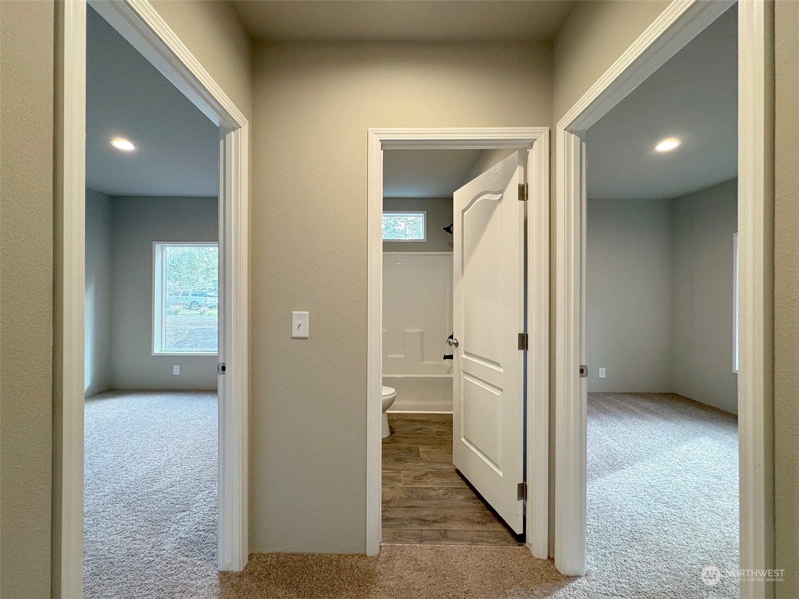 180 Madrona Way Sequim, WA 98382 - Photo 14 of 35 a view of a hallway with wooden shelves