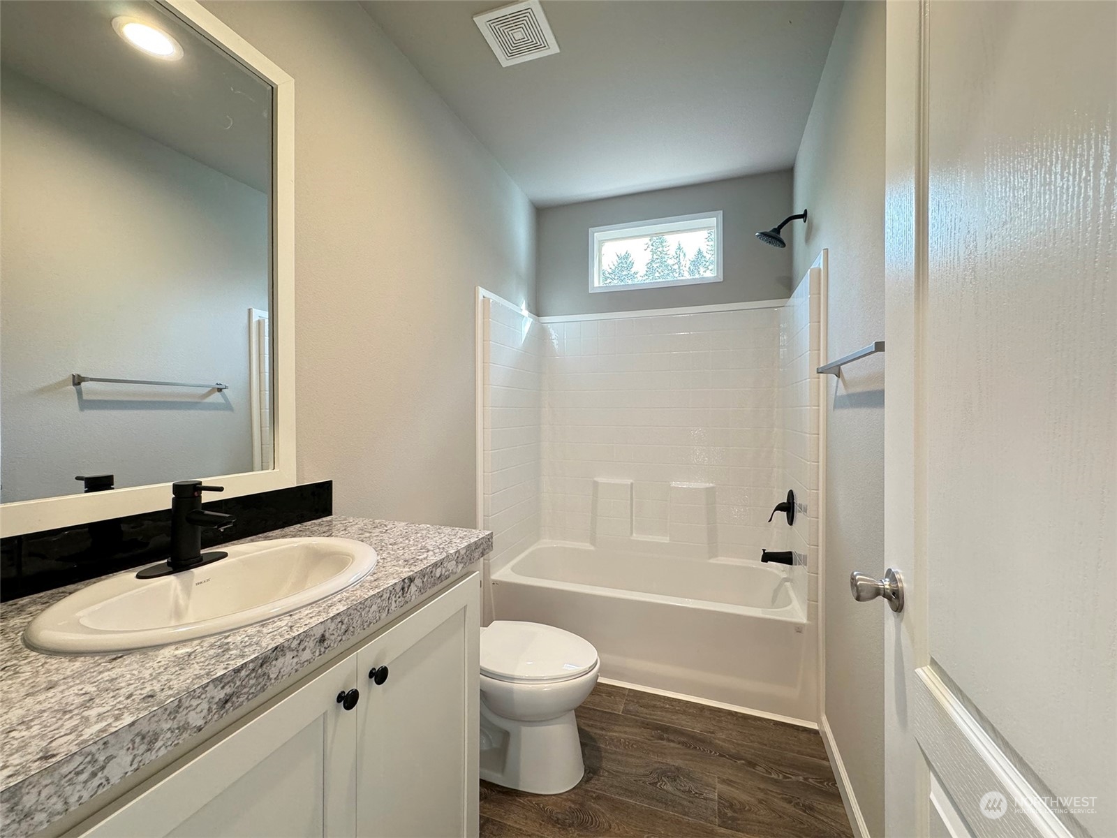 180 Madrona Way Sequim, WA 98382 - Photo 15 of 35 a bathroom with a granite countertop sink toilet a shower and a mirror