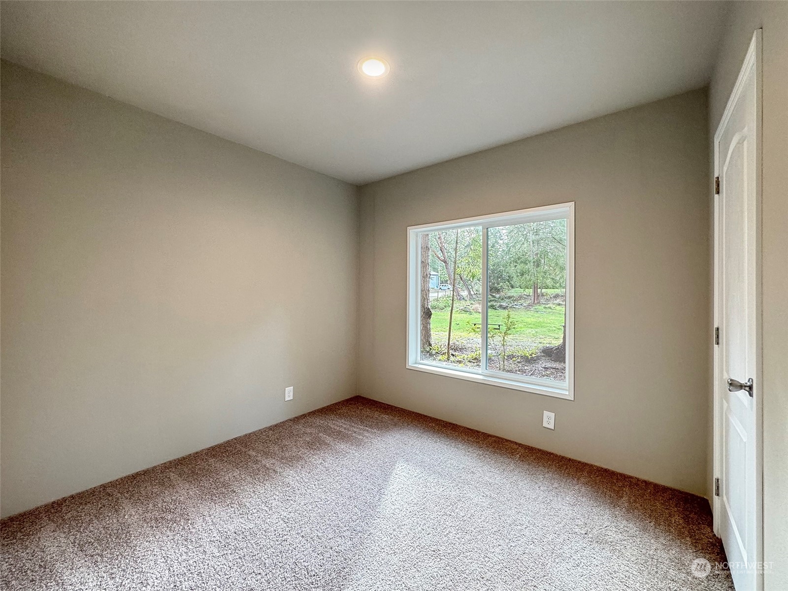 180 Madrona Way Sequim, WA 98382 - Photo 16 of 35 an empty room with a window