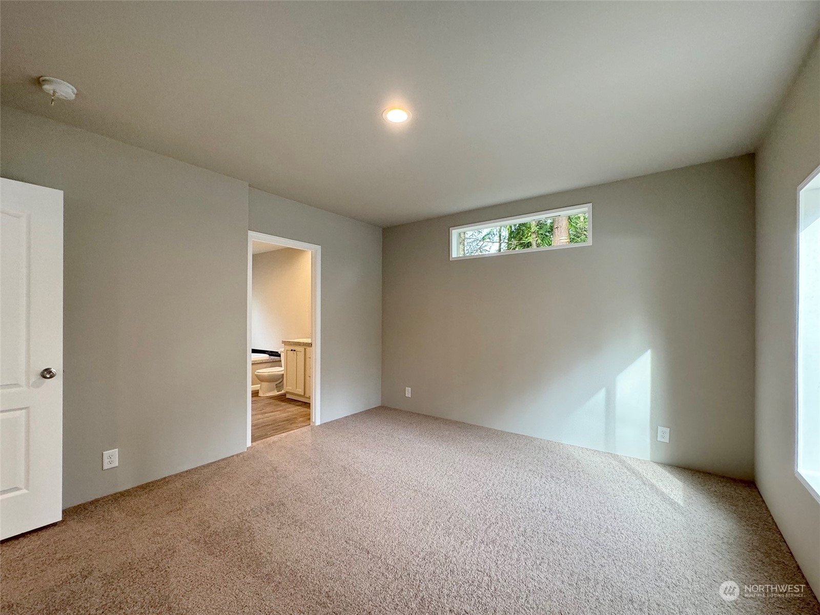 180 Madrona Way Sequim, WA 98382 - Photo 23 of 35 a view of an empty room with a window