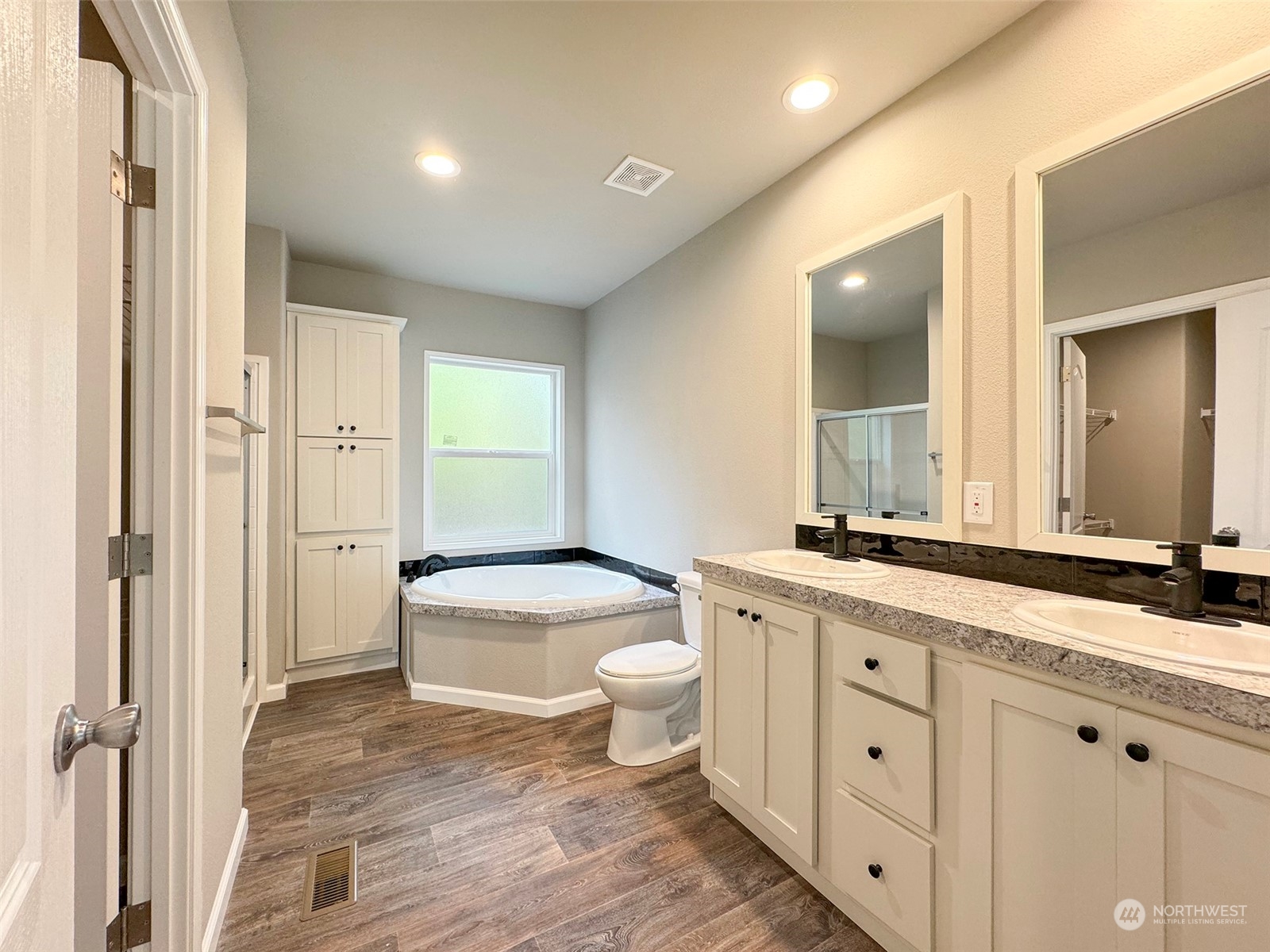 180 Madrona Way Sequim, WA 98382 - Photo 24 of 35 a bathroom with a granite countertop sink toilet and shower