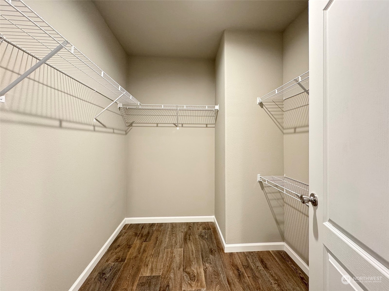 180 Madrona Way Sequim, WA 98382 - Photo 29 of 35 a view of a room with wooden floor and staircase