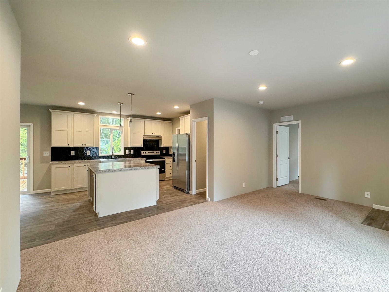 180 Madrona Way Sequim, WA 98382 - Photo 3 of 35 a view of kitchen with refrigerator sink and stove