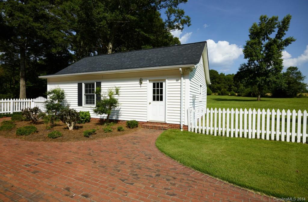 296 North Corner Estates Road Lancaster, SC 29720 - Photo 22 of 24 a front view of a house with a garden
